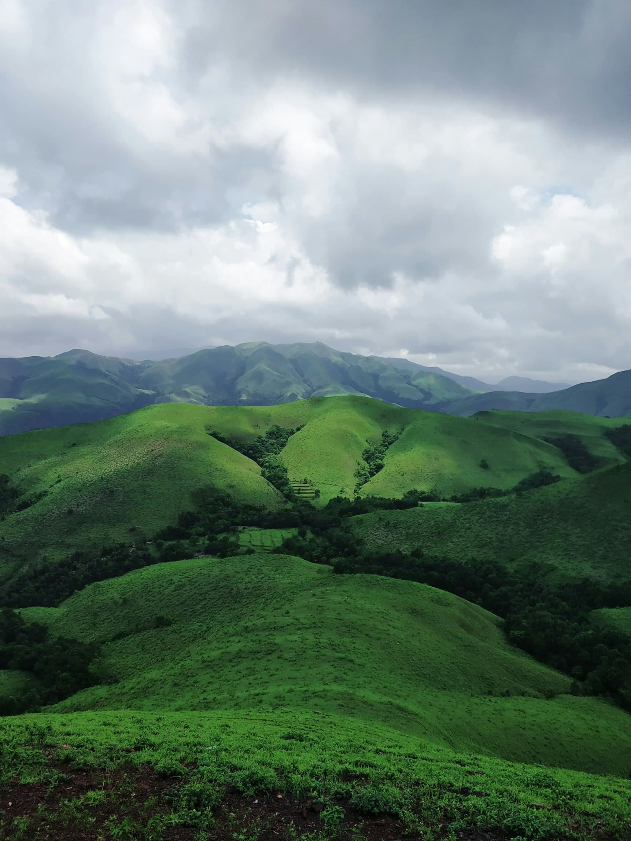Green hills under heavy cloud
